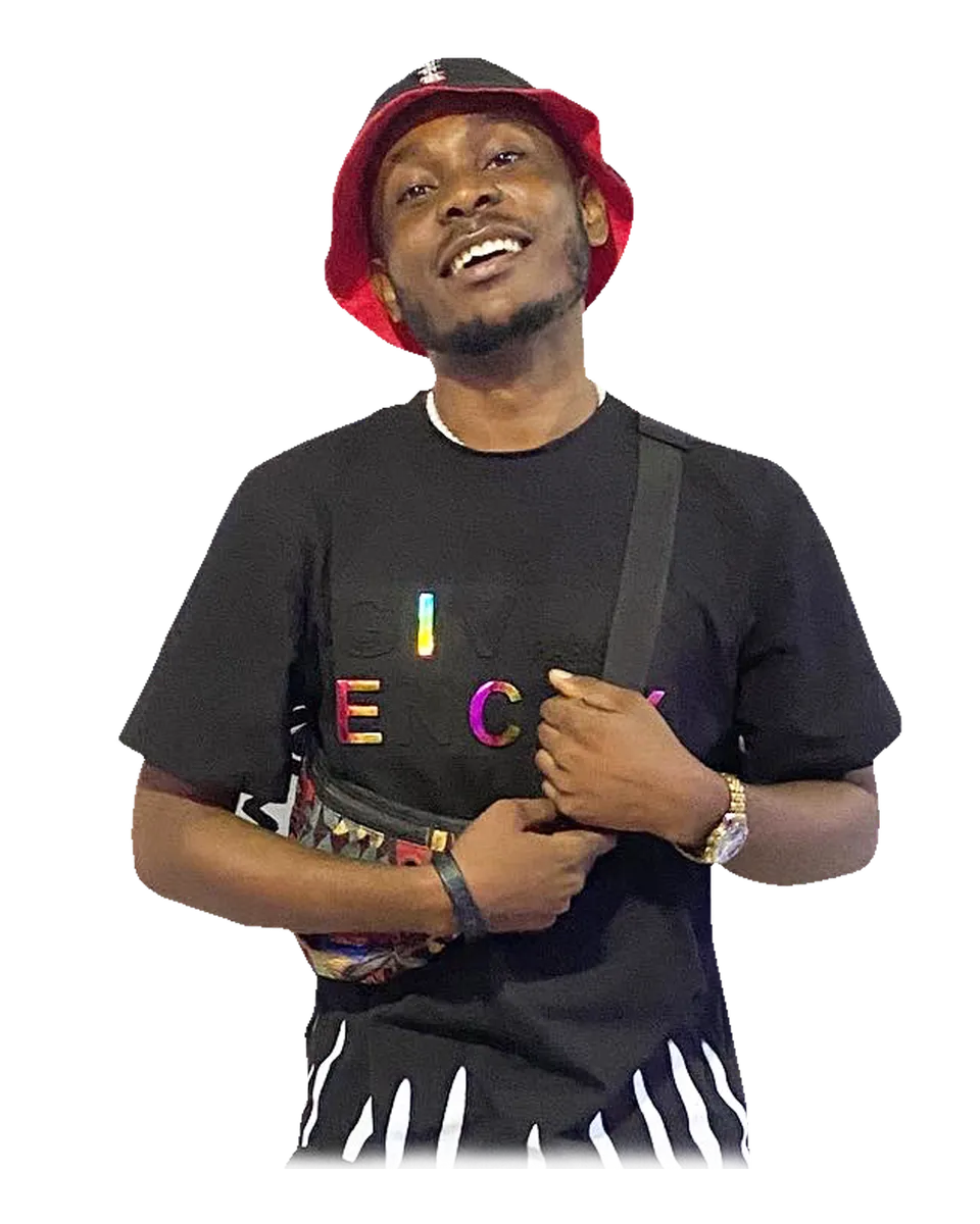 Khelz smiling in a red bucket hat and black outfit indoors
